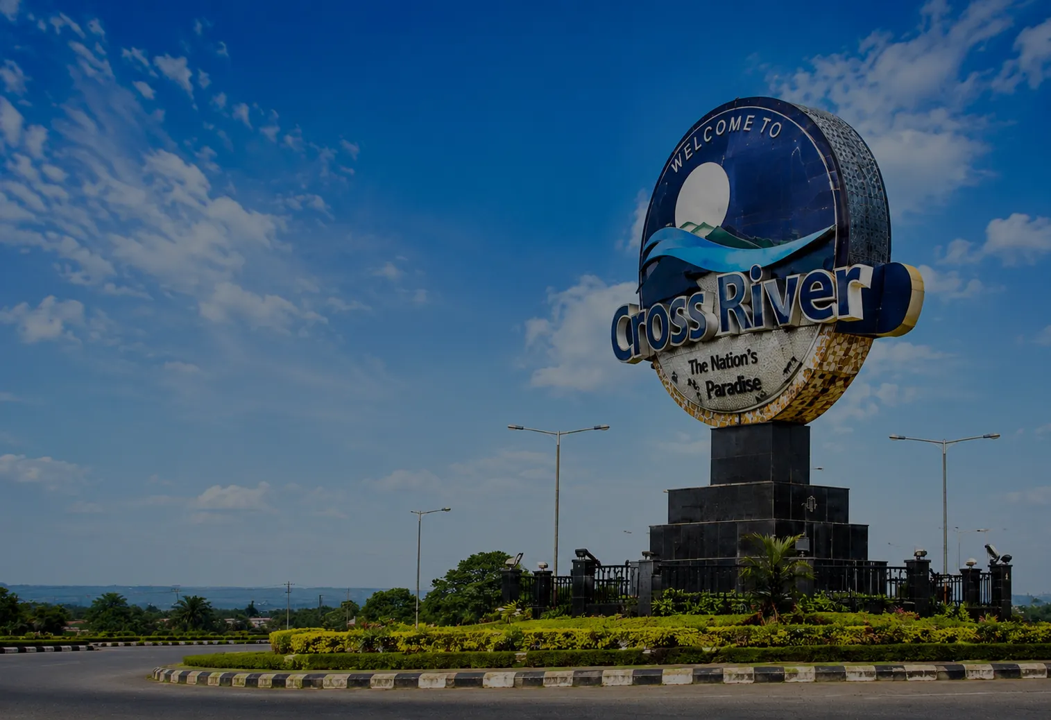 Welcome to Cross River: The Nation’s Paradise monument against a blue sky