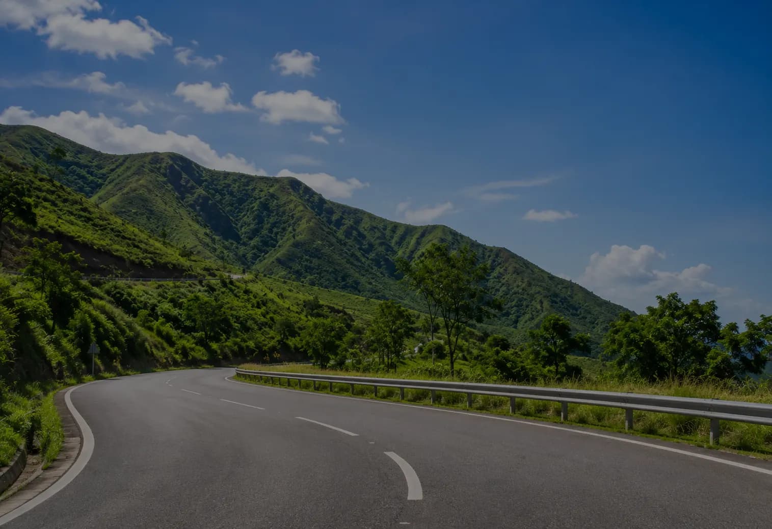 Winding highland road through green Cross River hills